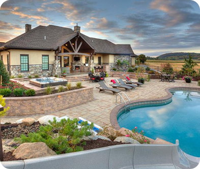 Large modern backyard with stone and swimming pool