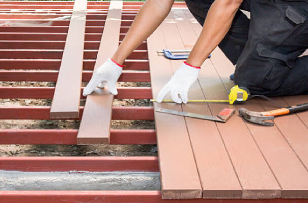 Laying deck with tools by contractor