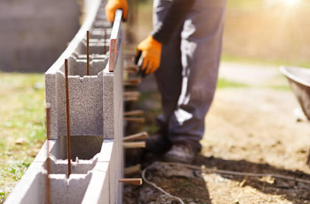 Constructing a cinderblock wall