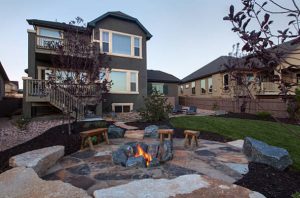 Outdoor patio surrounded by large stones