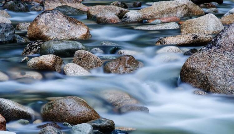 Stone creek with fresh water flowing through