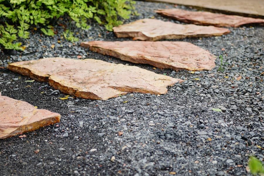 Stepping stone pathway on driveway outside home